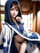 A woman in a blue and white robe posing for a picture.